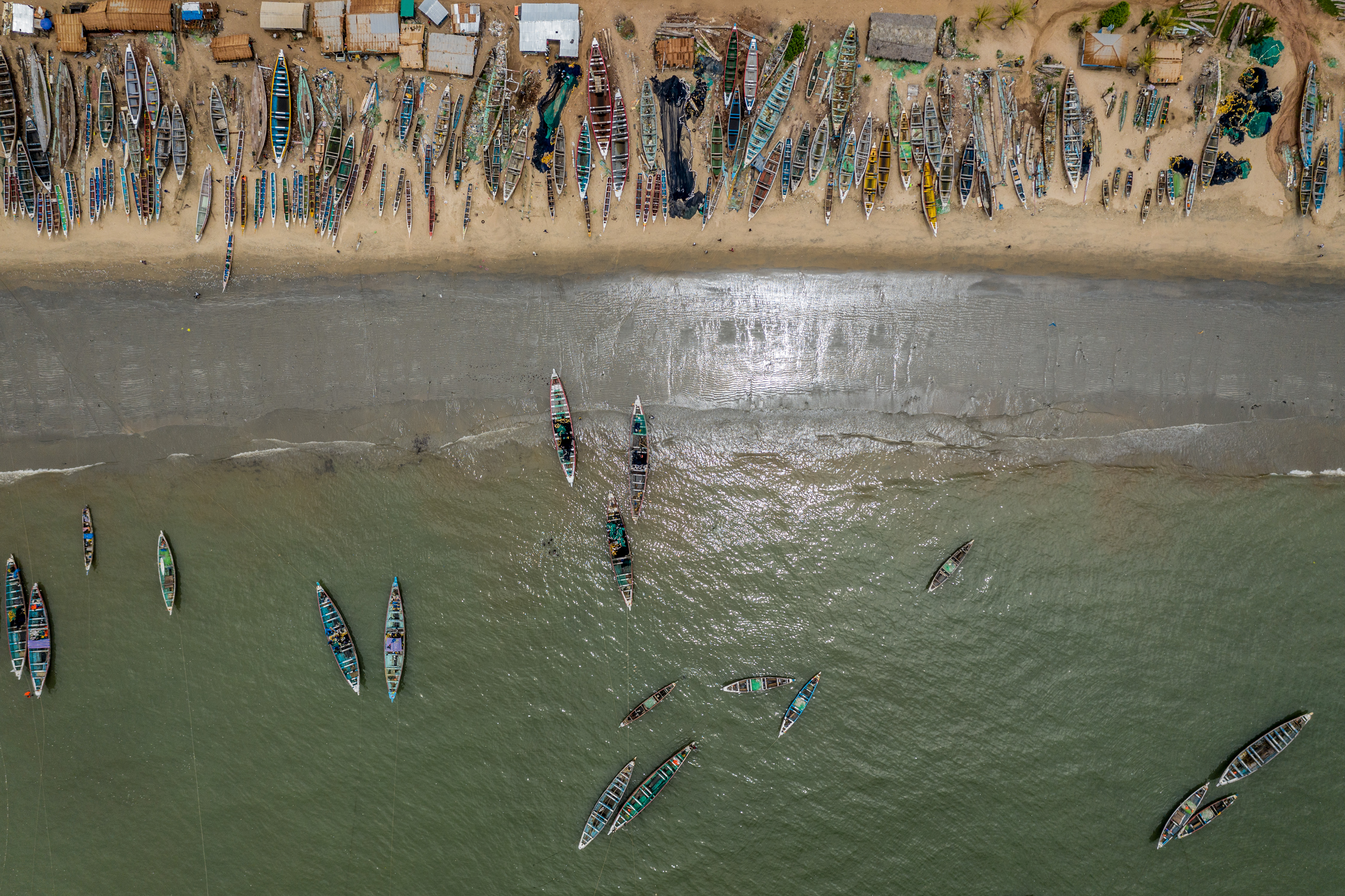 Fishing boats dotted the coastline in Gunjur, Gambia. The fishmeal industry redirected large amounts of fish into processing plants and away from local buyers, provoking concern over food insecurity and job losses.
