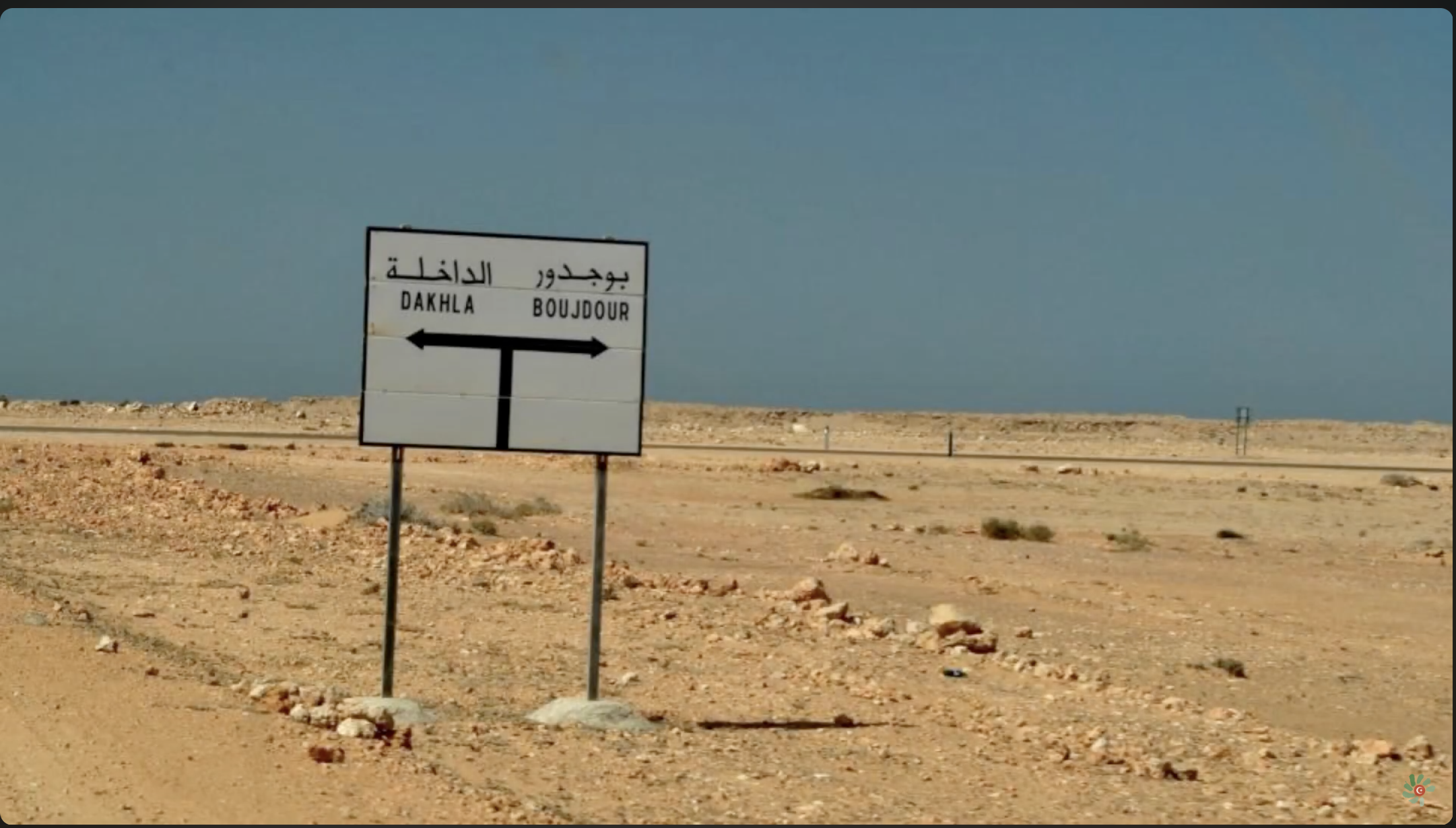 A sign indicated the road between Dakhla and Boujdour in occupied Western Sahara, 2024. Moroccan companies catch and process fish in Western Sahara and label it Moroccan before they export it to Europe.